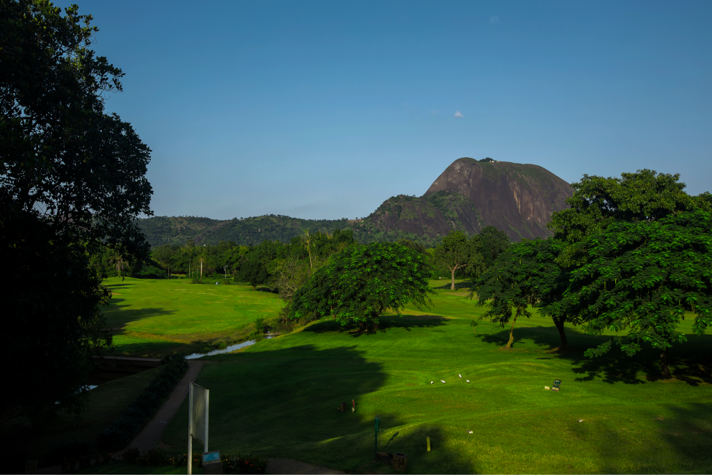 IBB Golf Club fairway with Aso Rock and a clear blue sky beyond