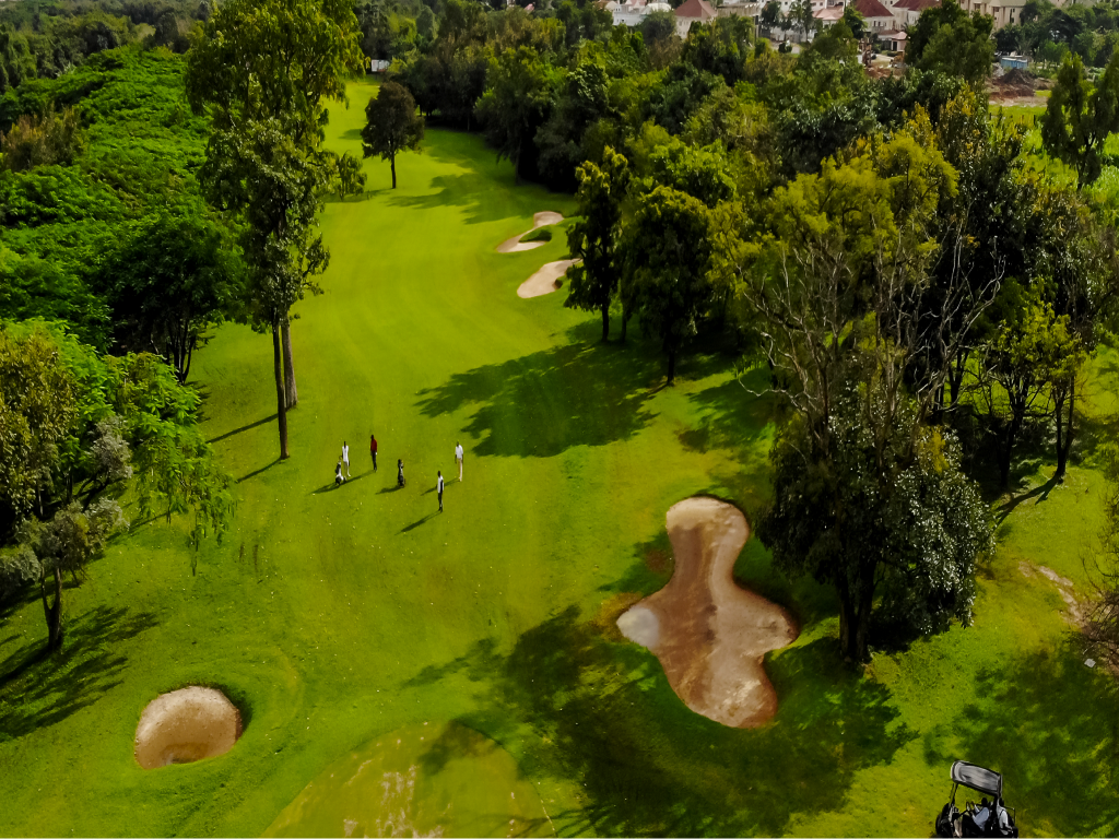 Hole 1 — a straight par 7 fairway looking toward Abuja's central business district