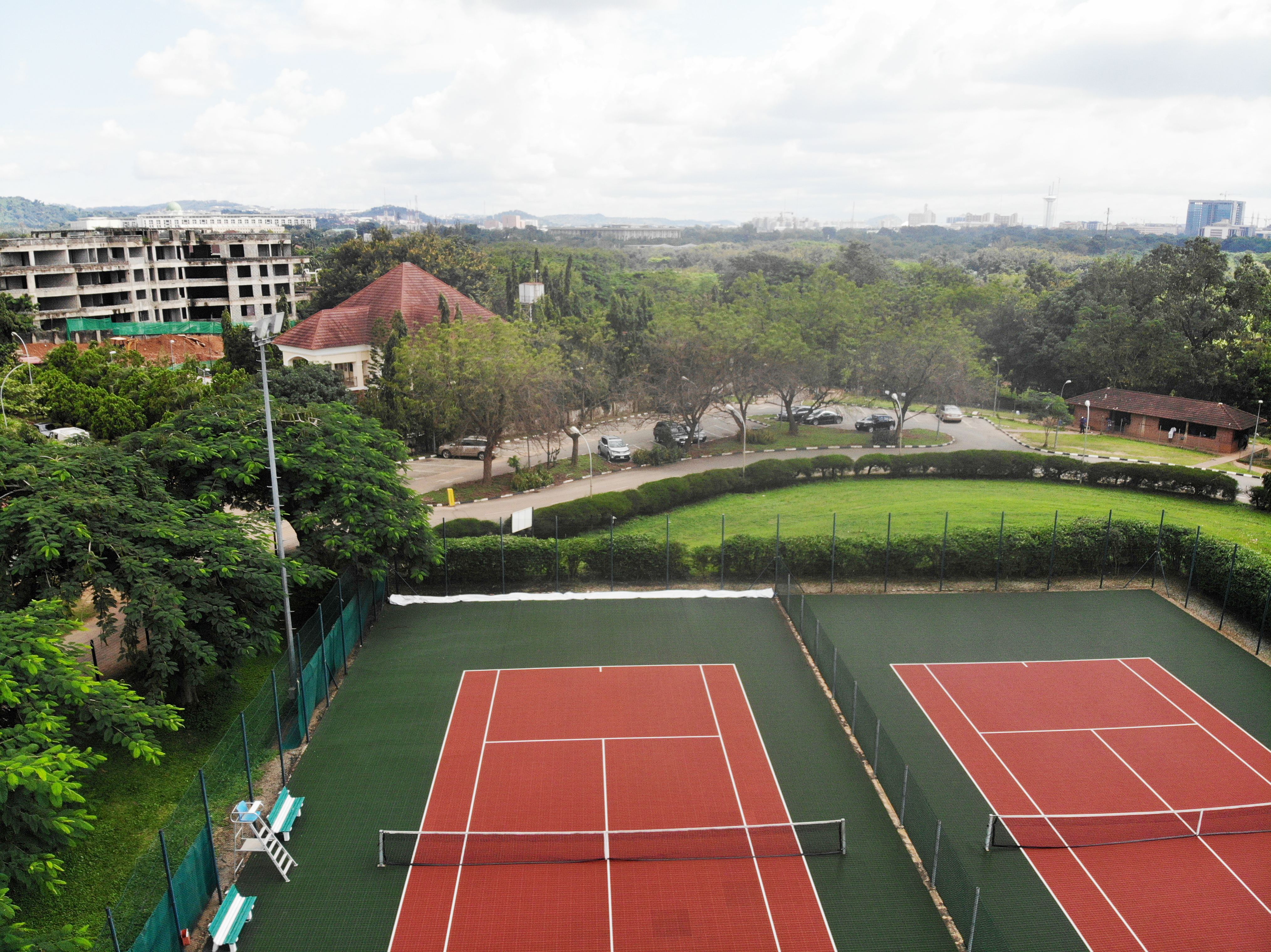 Tennis courts overlooking the Abuja skyline